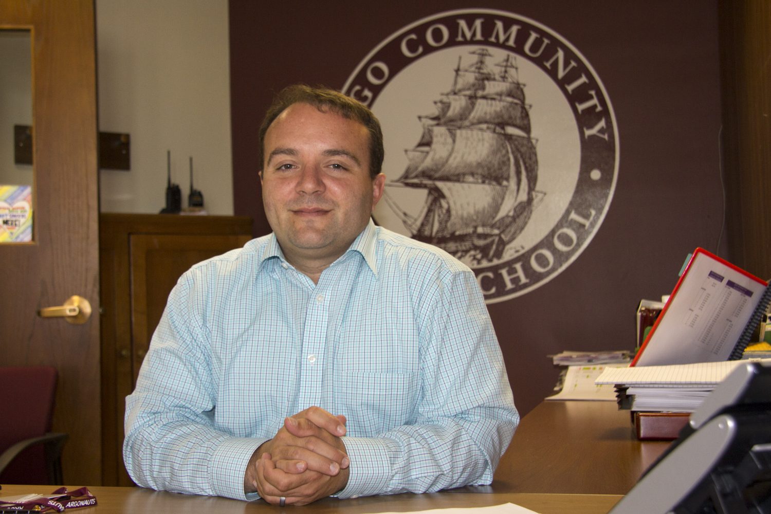 Argo Community High School Principal, Dr. Covino, at his desk.