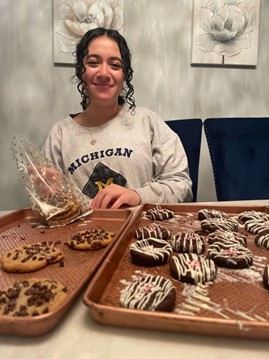 Amany packing homemade cookies for her teachers