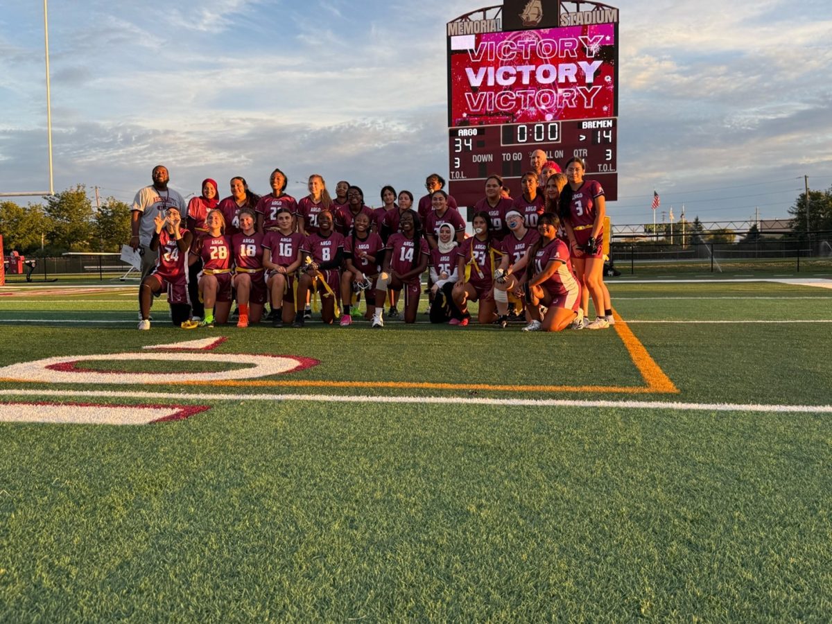 Girls Flag Football team poses under the scoreboard after their big victory.

Photo Courtesy of Jillian Pavel, Yearbook and Sports Media Photographer.