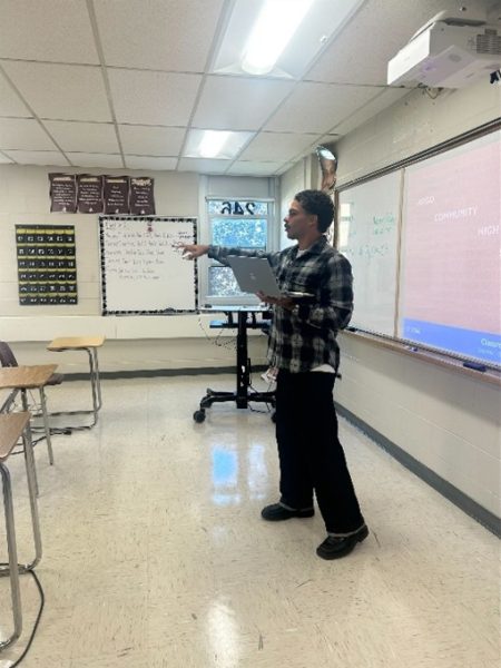 Hurd, in room 246, teaching his class. 