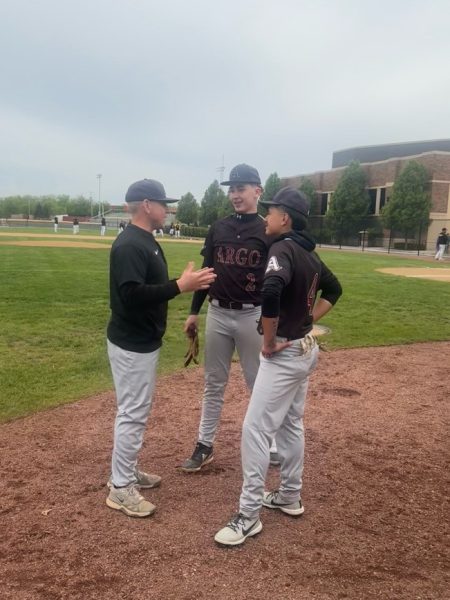Coach Strelow giving advice to his players before their game. 