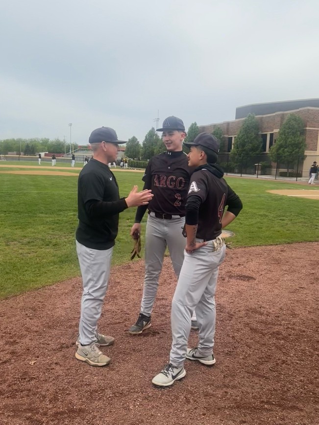 Coach Strelow giving advice to his players before their game. 